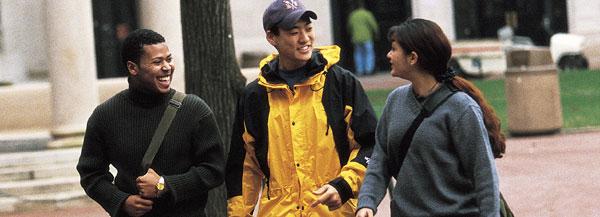 three students walking on campus
